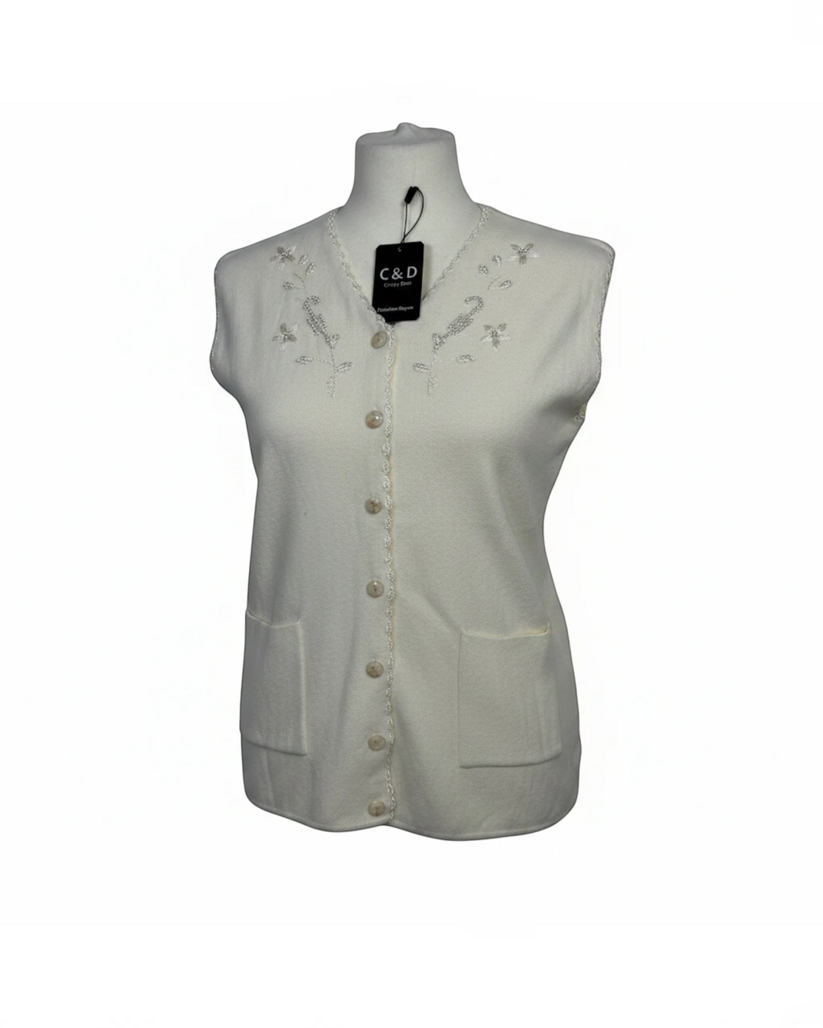 Cozy&Drape sleeveless cream knit cardigan featuring a V-neckline with delicate floral embroidery, beadwork, and pockets