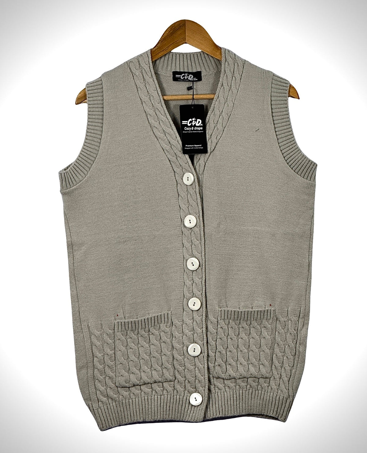 Cozy&Drape sleeveless cardigan sweater in light grey with a button-up front, V-neck, and cable knit pocket details.