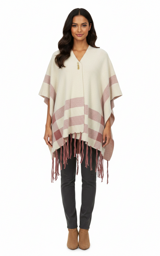 Cozy&Drape cream and dusty rose striped cape shawl with fringe hem worn by a woman against a white background