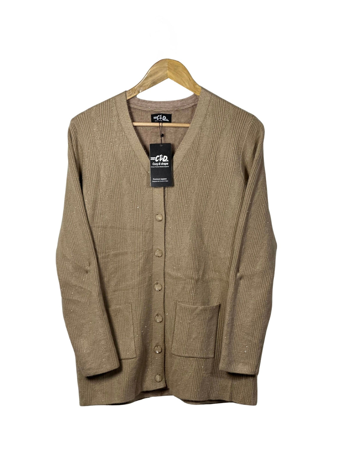 Cozy&Drape beige full sleeve cardigan sweater with front pockets and button-down closure on a wooden hanger