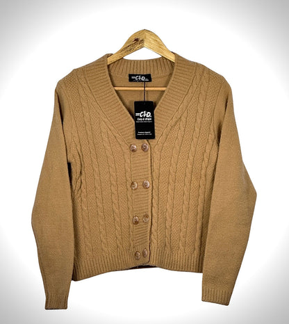 Cozy&Drape tan cable knit extra short cardigan sweater with a V-neck and button-up front on a wooden hanger