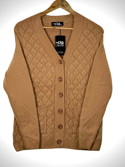Cozy&Drape tan button-up cardigan sweater with a diamond knit pattern and front pockets on a wooden hanger