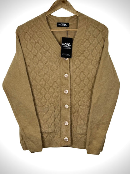 Cozy&Drape tan button-up cardigan sweater with a diamond knit pattern and front pockets on a wooden hanger.