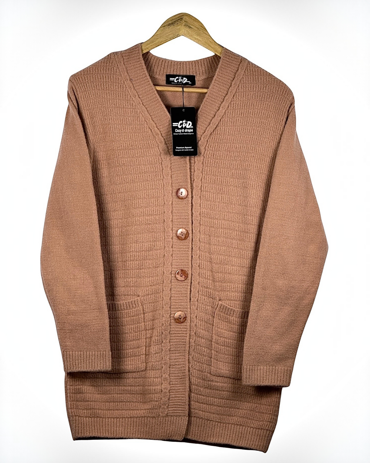 Cozy&Drape long button-up cardigan sweater in warm tan with front pockets and ribbed knit texture on a hanger