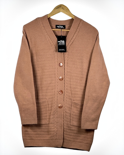 Cozy&Drape long button-up cardigan sweater in warm tan with front pockets and ribbed knit texture on a hanger