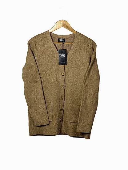 Cozy&Drape tan wool cardigan sweater with long sleeves, front button closure, and two pockets on a wooden hanger.