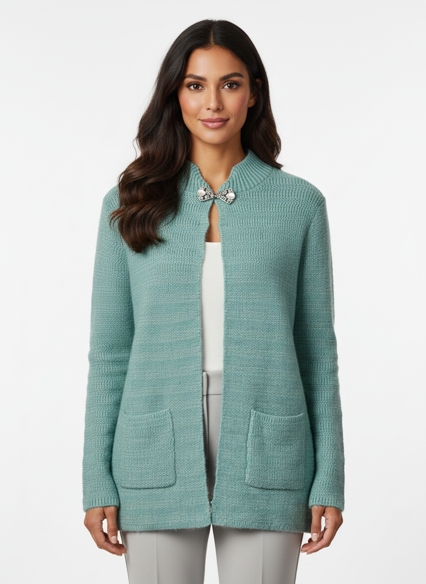 Cozy&Drape teal knit cardigan with mock neck, decorative brooch closure, and front pockets worn by a model.