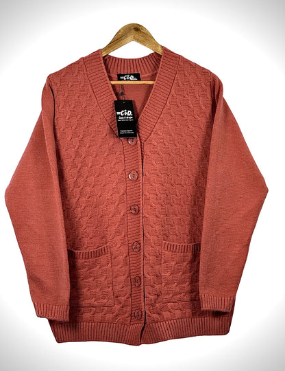 Cozy&Drape terracotta cable knit cardigan sweater with long sleeves, front buttons, and two patch pockets.